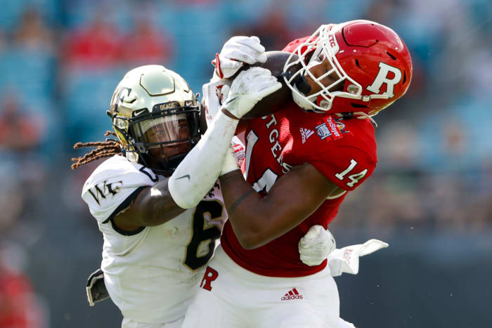 #6 Ja'Sir Taylor tries to knock the ball loose from the Rutgers receiver in the 2021 Gator Bowl